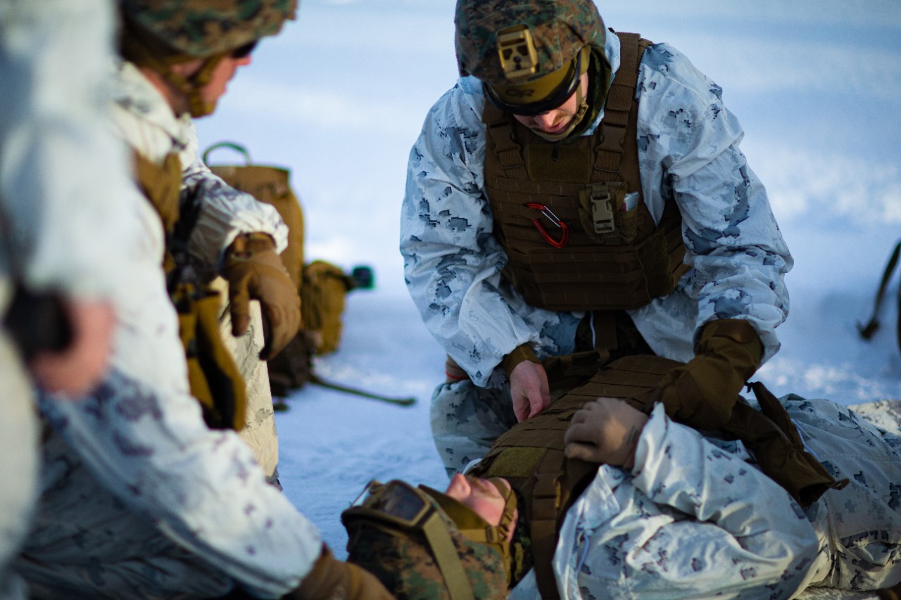 U.S. Navy Hospitalman Cody Graham, from Palm Springs, California, with II Marine Expeditionary Force performs medical procedures on a simulated injured Marine