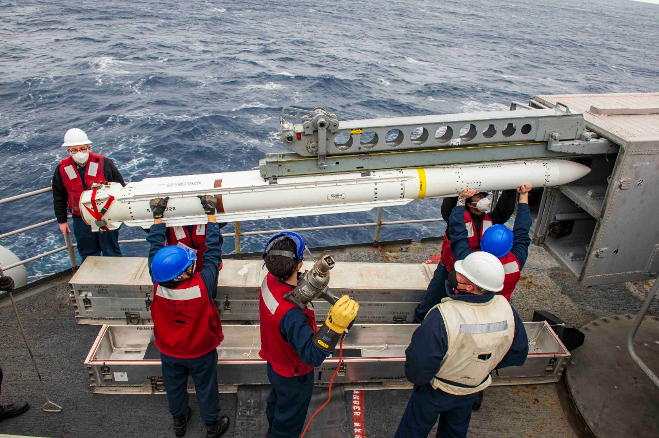 Sailors load a NATO Sea Sparrow missile