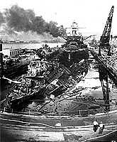 Wrecked destroyers USS Downes and USS Cassin in dry-dock for repairs