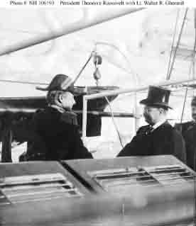 President Theodore Roosevelt (right) shakes hands with Lieutenant Walter R. Gherardi, Commanding Officer, Yankton, 16 December 1907.