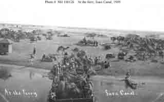 View of camel caravan at canal ferry crossing, taken from one of fleet's battleships during transit of Suez Canal, January 1909.