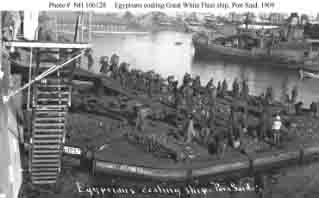 Local workers coaling one of fleet's battleships at Port Said, Egypt, following January 1909 Suez Canal transit.