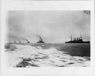 Atlantic Fleet cruisers steam in column as they welcome the Great White Fleet upon its return to Hampton Roads, Virginia, 22 February 1909.