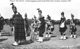 Scotch bagpipers and bandsmen at ceremony during fleet's visit to Sydney, New South Wales, Australia, August 1908.
