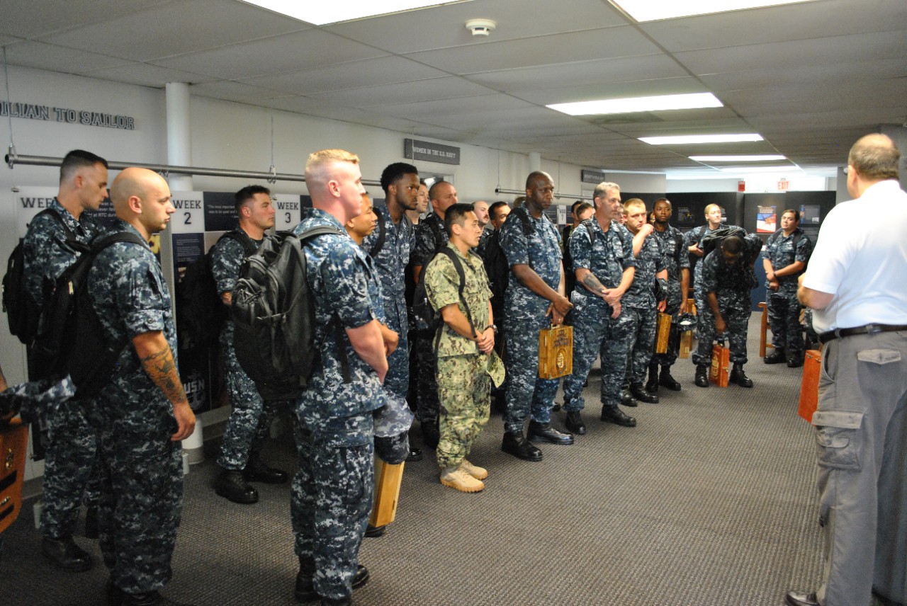 A tour of sailors visits the National Museum of the American Sailor