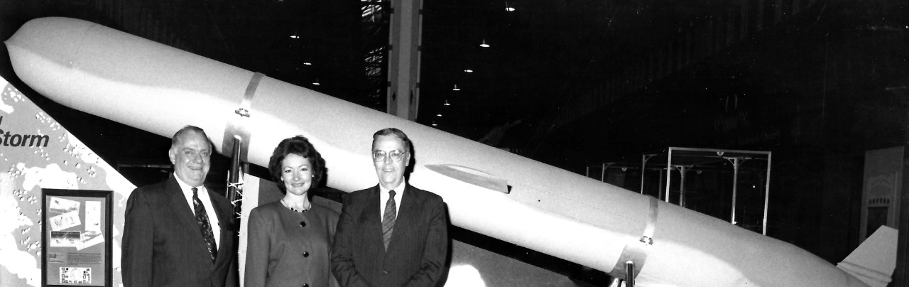 <p class="MsoNormal" style="margin-bottom: .0001pt; line-height: normal;">NMUSN-69:&nbsp;&nbsp; Presentation of Tomahawk Land Attack Missile, January 26, 1993.&nbsp;&nbsp;&nbsp; A presentation was held at the Navy Museum (now National Museum of the U.S. Navy) on the acceptance for display purposes.&nbsp;&nbsp; From left to right:&nbsp; Dr. Dean Allard, Director of the Naval Historical Center (now Naval History and Heritage Command), Mrs. Clauda Pennington, Acting Director of the Navy Museum, and an unidentified gentleman.&nbsp; &nbsp;&nbsp;National Museum of the U.S. Navy Photograph Collection.&nbsp;</p>
