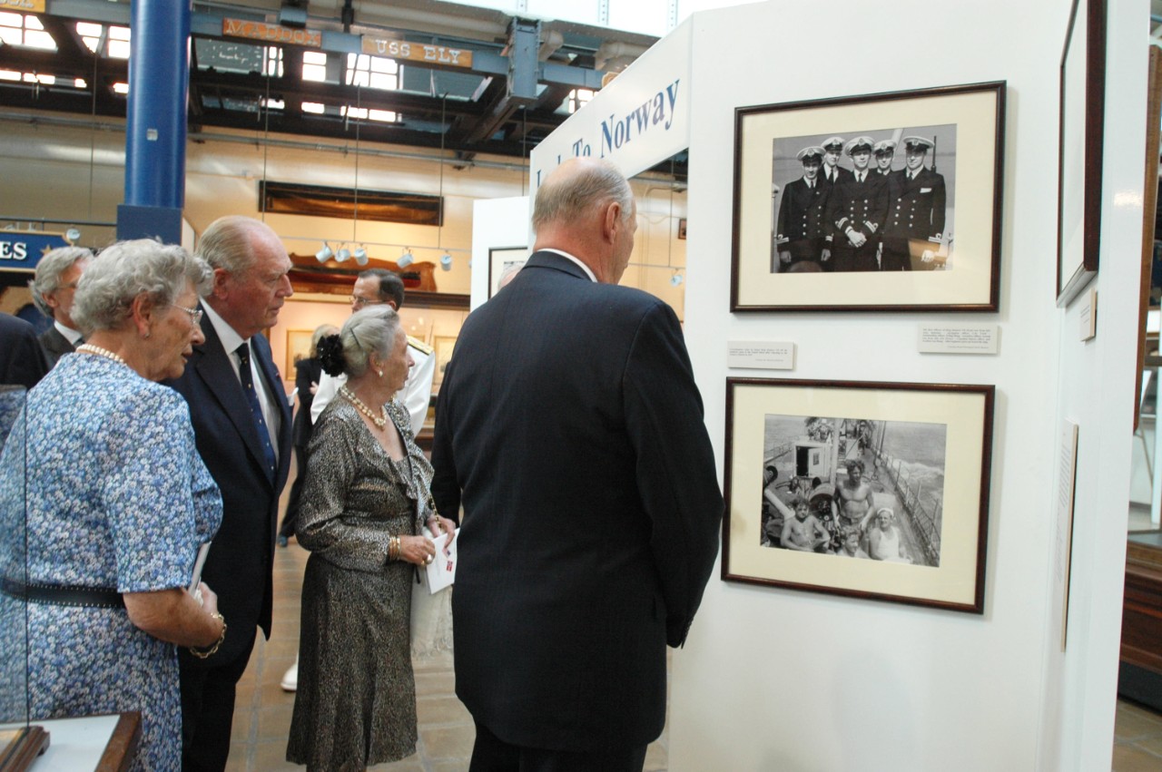 050919-N-23838-198: Washington Navy Yard, Washington, D.C. (September 19, 2005). His Majesty King Harald V of Norway, far right, looks at the Look to Norway exhibit done in honor of his visit at the Navy Museum located at the Yard. Behind the gue...
