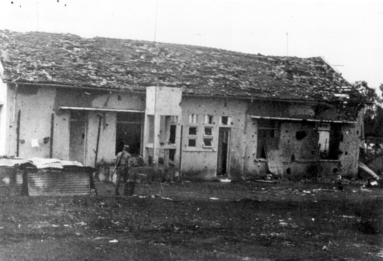 Rear view of the District Headquarters Building at Dong Xoai, June 1965. The surviving American troops made their way to the District Headquarters Building but were quickly surrounded by an almost overwhelming Viet Cong. 