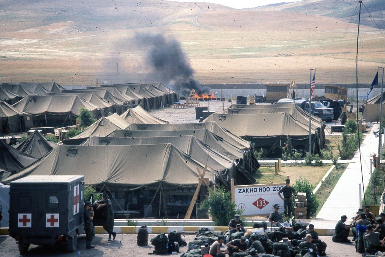 ‘Roo Zoo Admin Area with Burnouts in the Background, Operation Provide Comfort, Kurdistan, 1991.