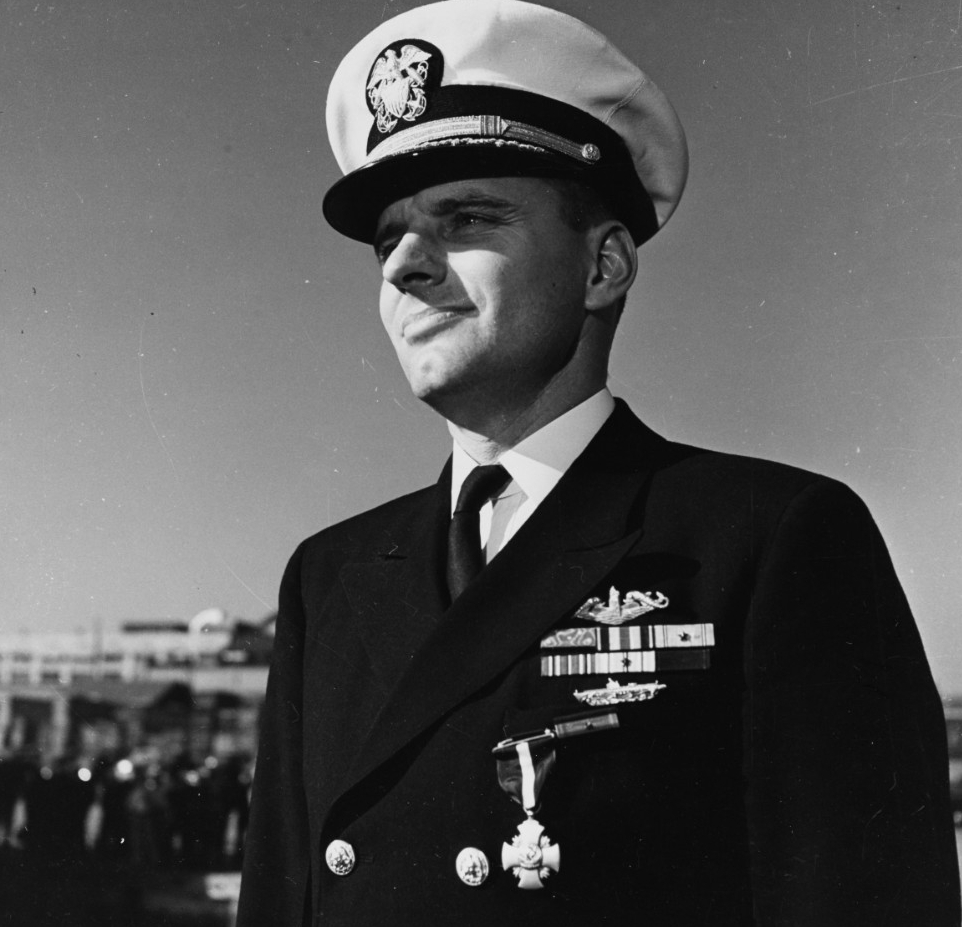 Commanding Officer of USS Tirante (SS-420) At the Washington Navy Yard, D.C., just after receiving the Navy Cross from Secretary of the Navy James Forrestal on 19 October 1945. He was awarded the medal for extraordinary ship-hunting efforts durin...