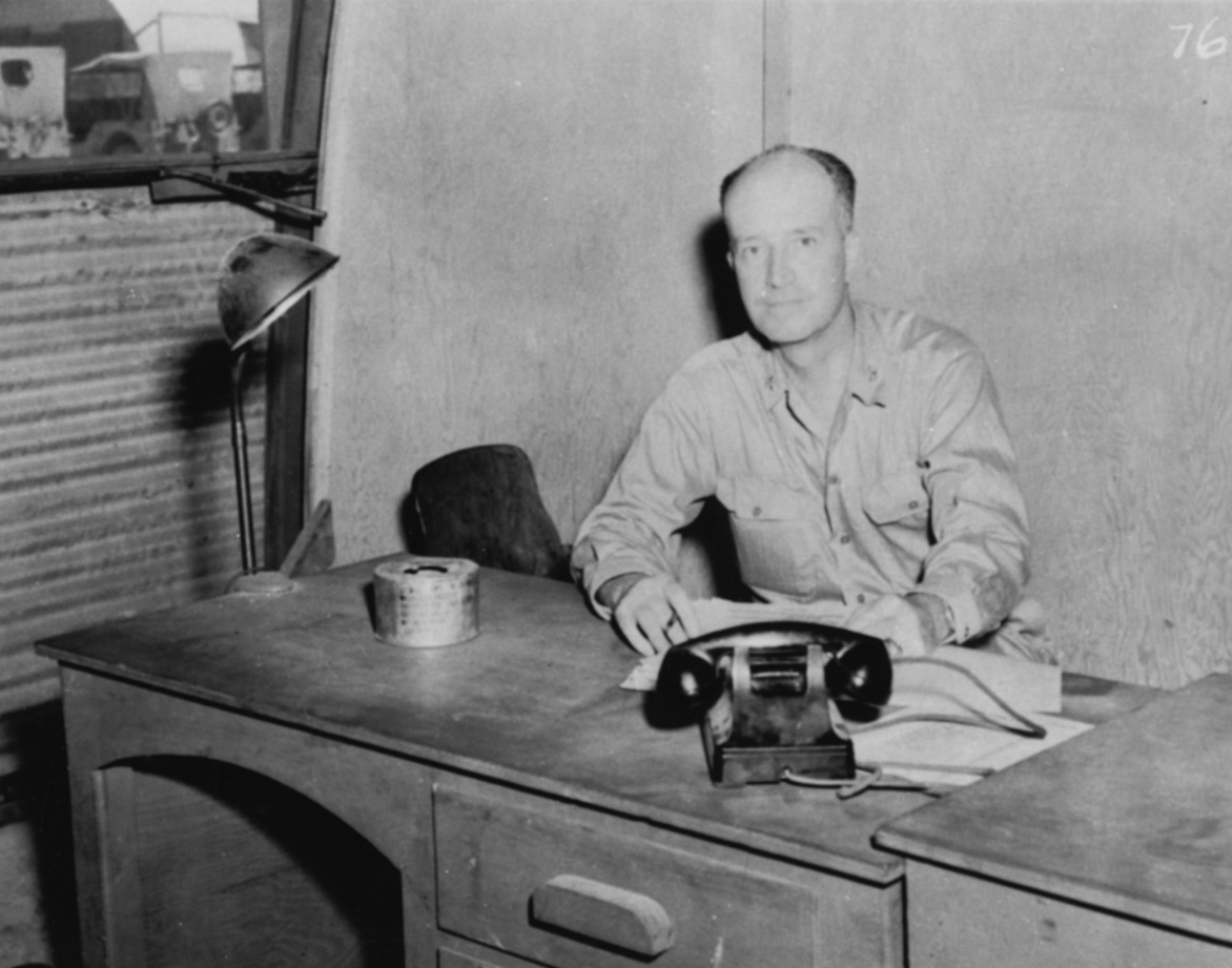 Black-and-white photograph of Captain William S. Parsons seated in front of a small desk.