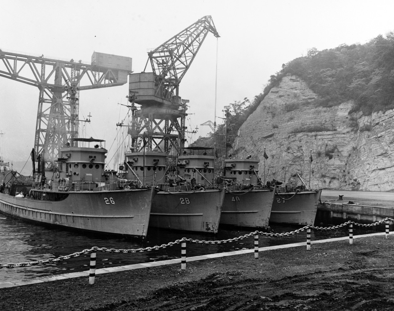 Four U.S. Navy minesweepers (AMS) tied up at Yokosuka, Japan