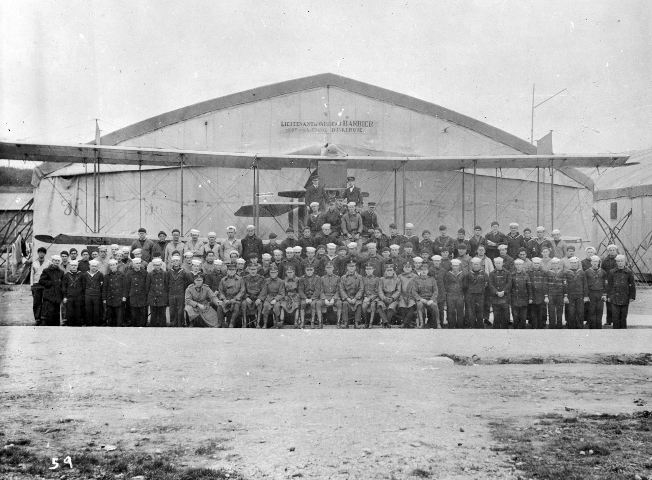 Personnel, aircraft, and hangar at Treguier Air Station- WWI. Part of the US Naval Aviation French Unit Collection.