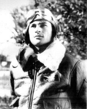 Portrait of a man in a pilot's jacket and helmet. 