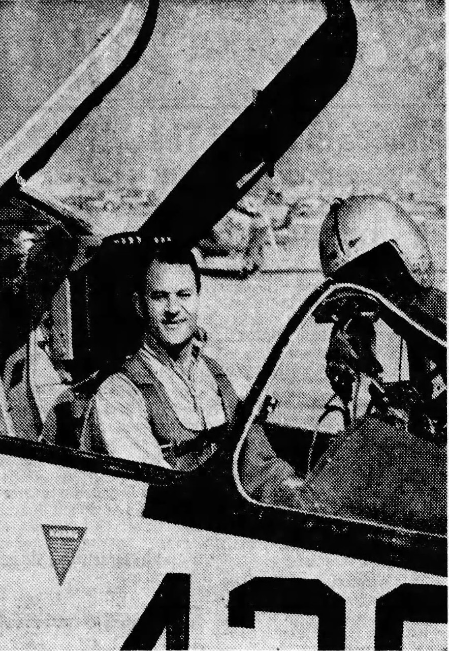 Man sitting in the cockpit of a fighter jet. 