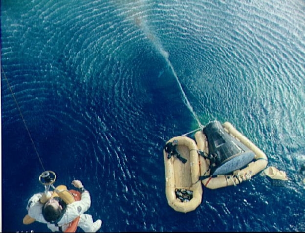 Navy frogman assist Gemini 10 astronauts following splashdown