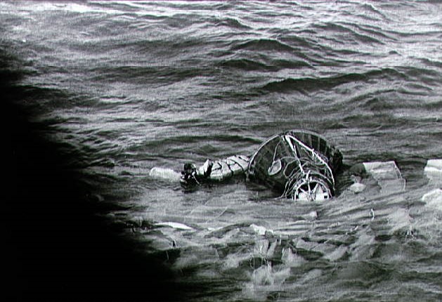 Navy frogmen attach flotation collar to Gemini 10 spacecraft