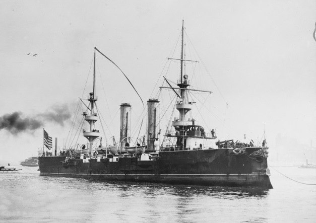 New Orleans (1898-1929) arrives off the New York Navy Yard, April 1898, after crossing the Atlantic. Note oversize commissioning pennant flying from her main mast.