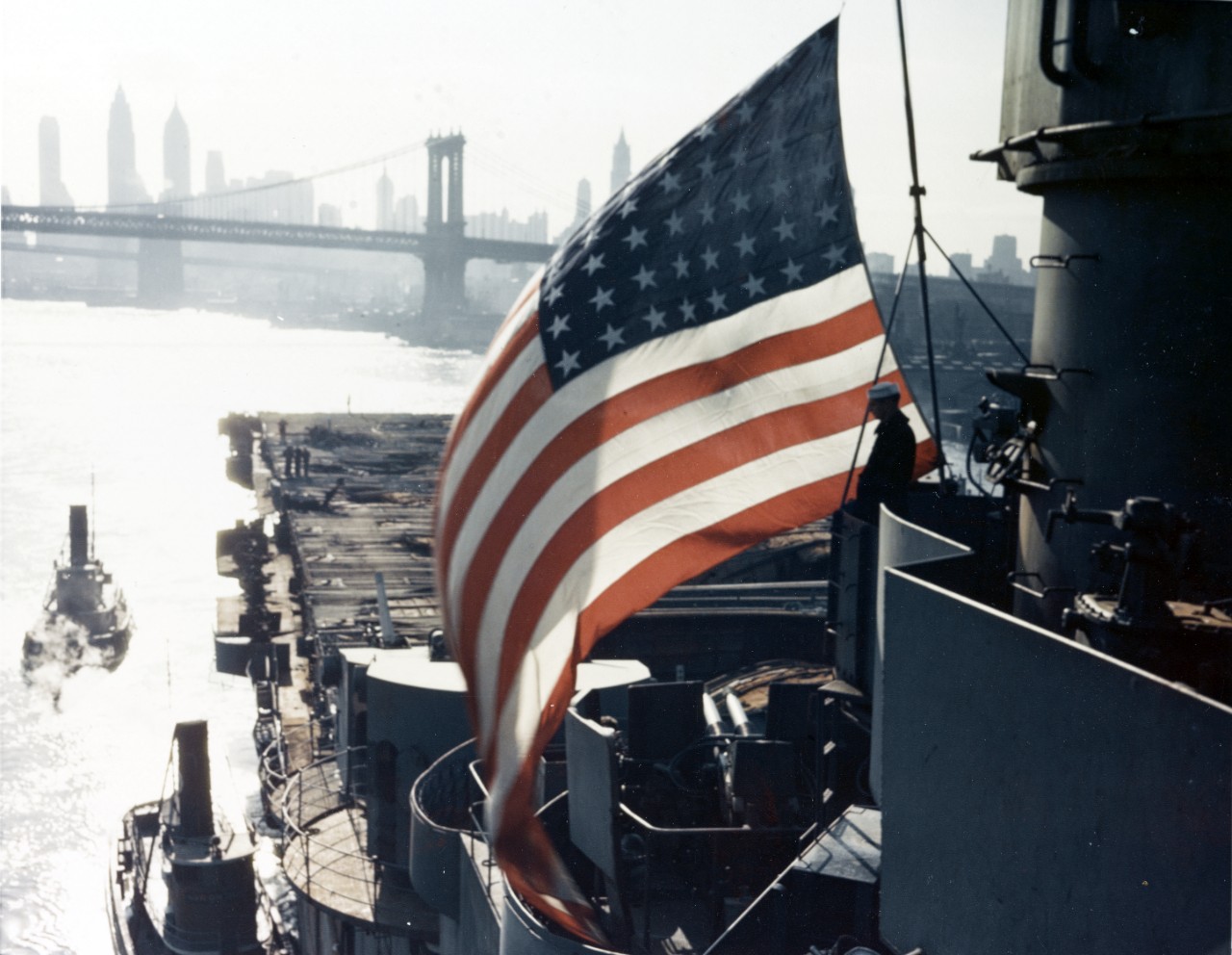 80-G-K-6065 USS FRANKLIN (CV-13) arrives at New York Navy Yard for repair of battle damage, circa 28 April 1945  