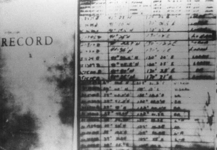 Poor quality photograph of apparent position entries from the log of Pueblo issued by the North Korean government to support their claim that Pueblo had entered that state's territorial waters. Click image to download.
