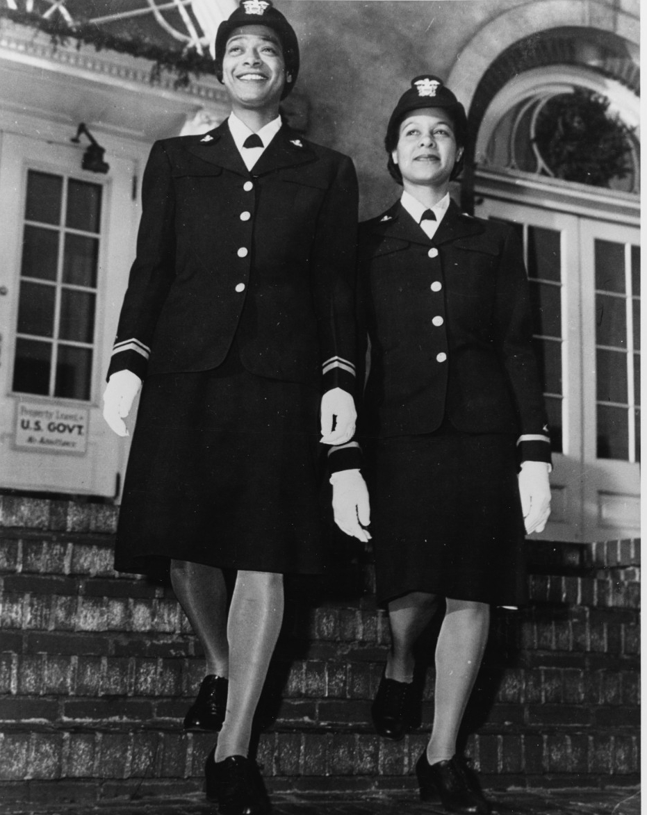 Lieutenant (Junior Grade) Harriet Ida Pickens (left) and Ensign Frances Wills photographed after graduation from the Naval Reserve Midshipmen's School (WR) at Northampton, Massachusetts, in December 1944. They were members of the school's final c...