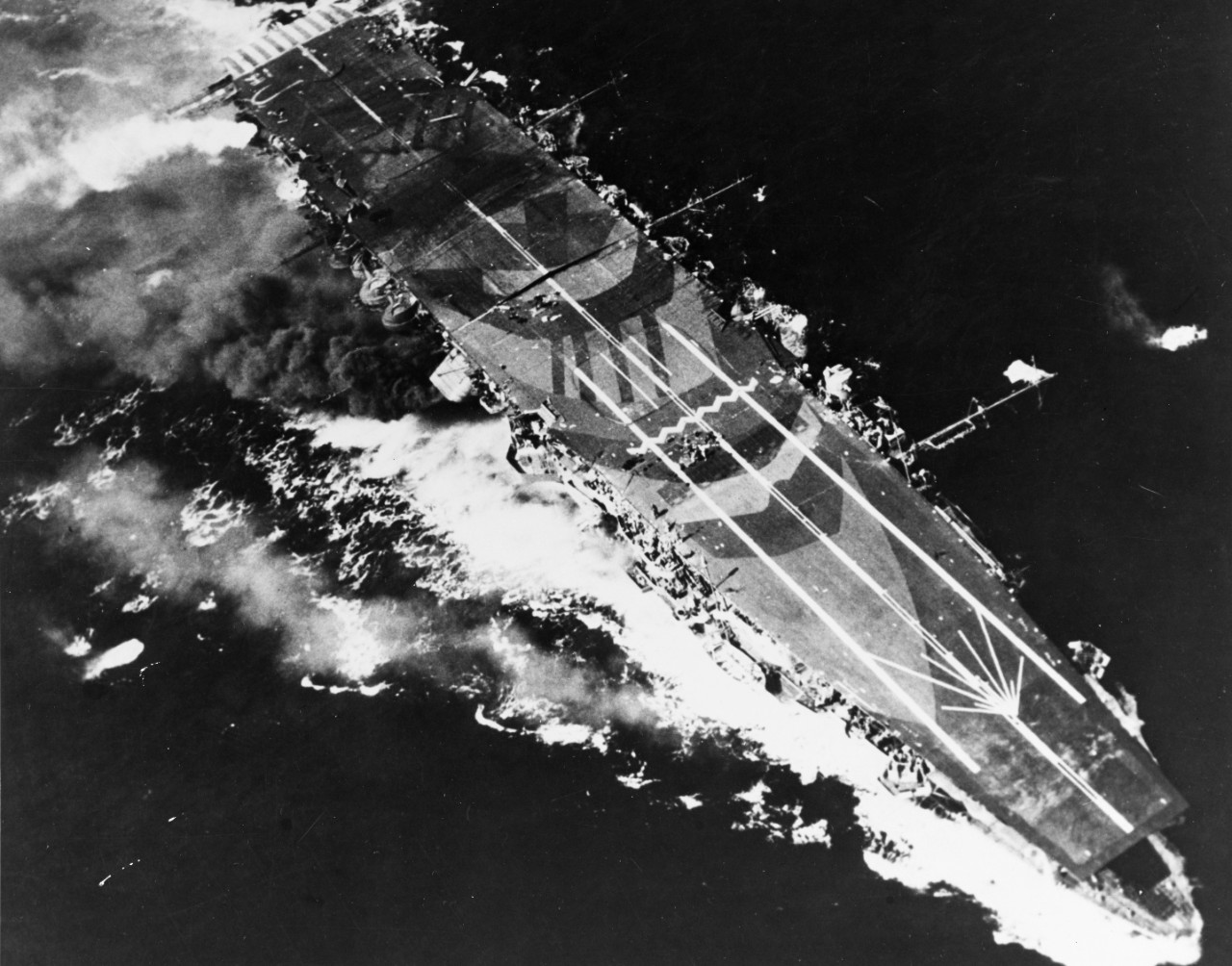 Japanese aircraft carrier Zuiho under attack by planes from USS Enterprise during the Battle off Cape Engano, 25 October 1944.