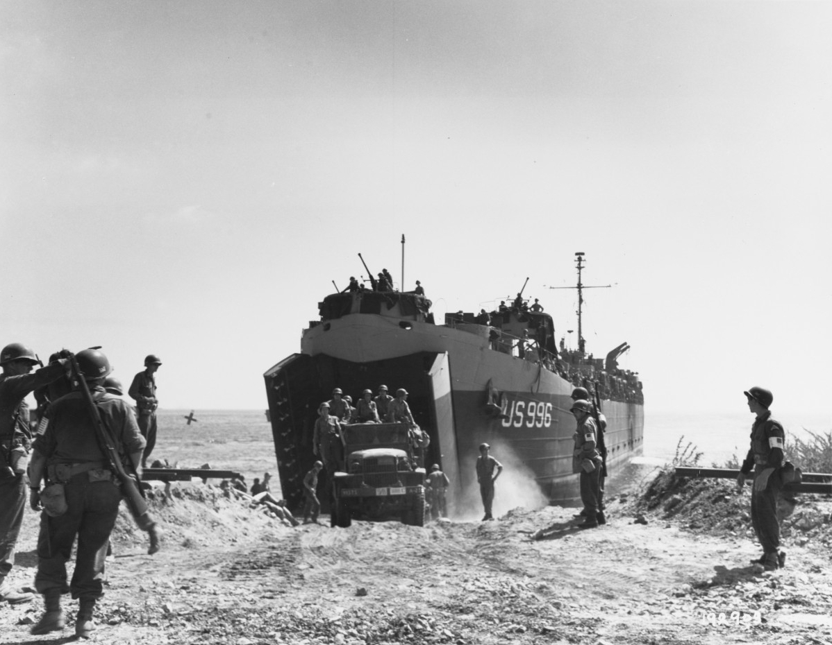 Southern France Invasion, August 1944. An Army truck drives ashore from USS LST-996, the first LST to reach the beach