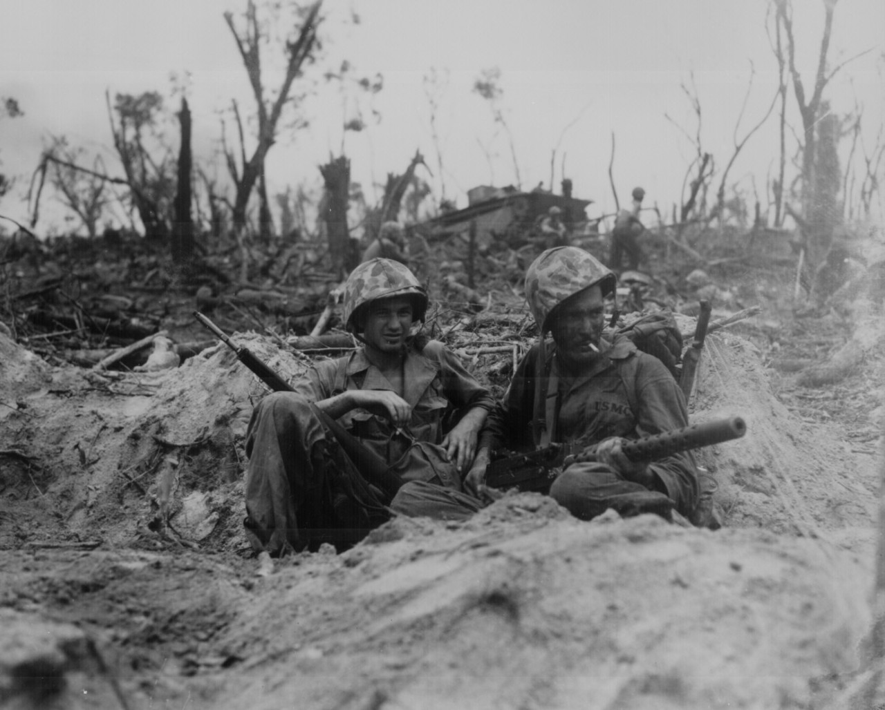 Marines take time out for a cigarette during the heavy fighting on Peleliu, September 1944 (127-N-97628).
