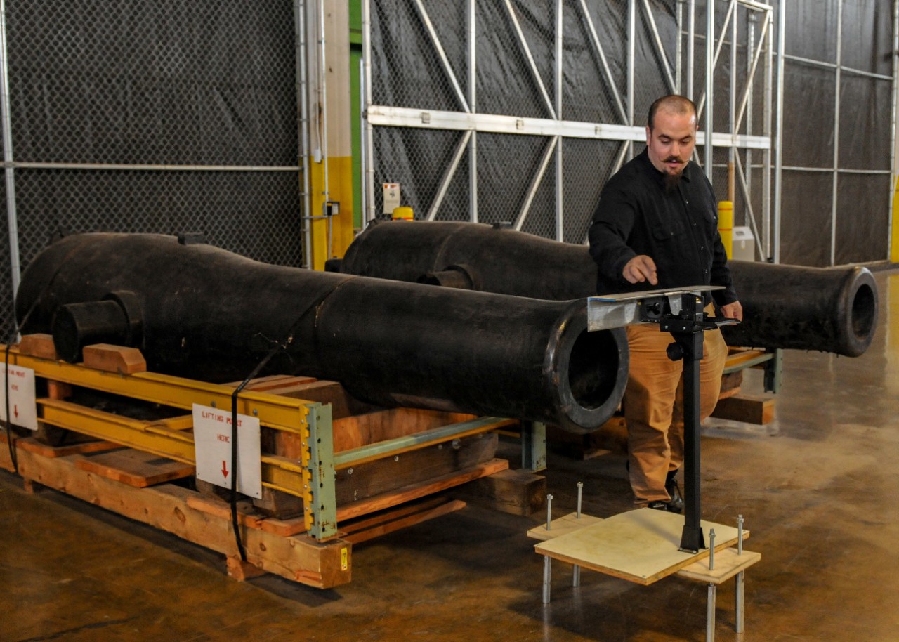archaeological conservator from the Mariners’ Museum and Park located in Newport News, works with a device to collect measurement data from a Dahlgren smoothbore shell gun from Kearsarge I (Sloop-of-War)