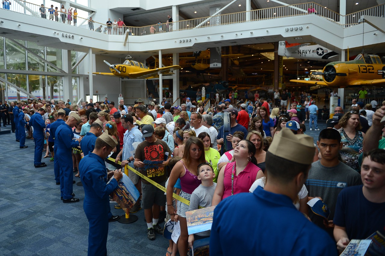 The Blue Angels, sign autographs at the National Naval Aviation Museum at Naval Air Station Pensacola