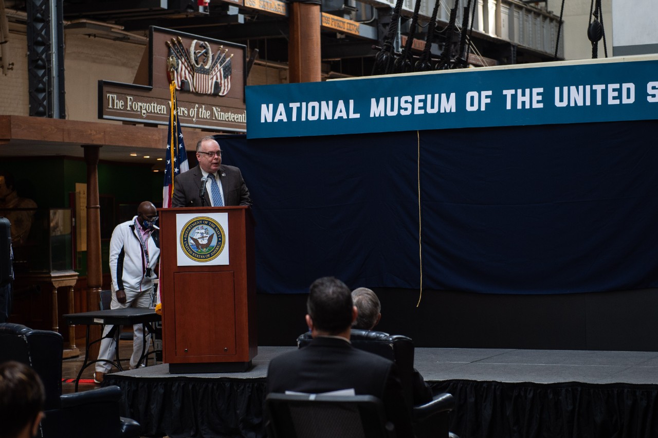 Retired Rear Adm. Sam J. Cox, Director, Naval History and Heritage Command (NHHC), gives a speech during the announcement ceremony of the new National Museum of the United States Navy (NMUSN) in the current NMUSN. To honor the service of American...