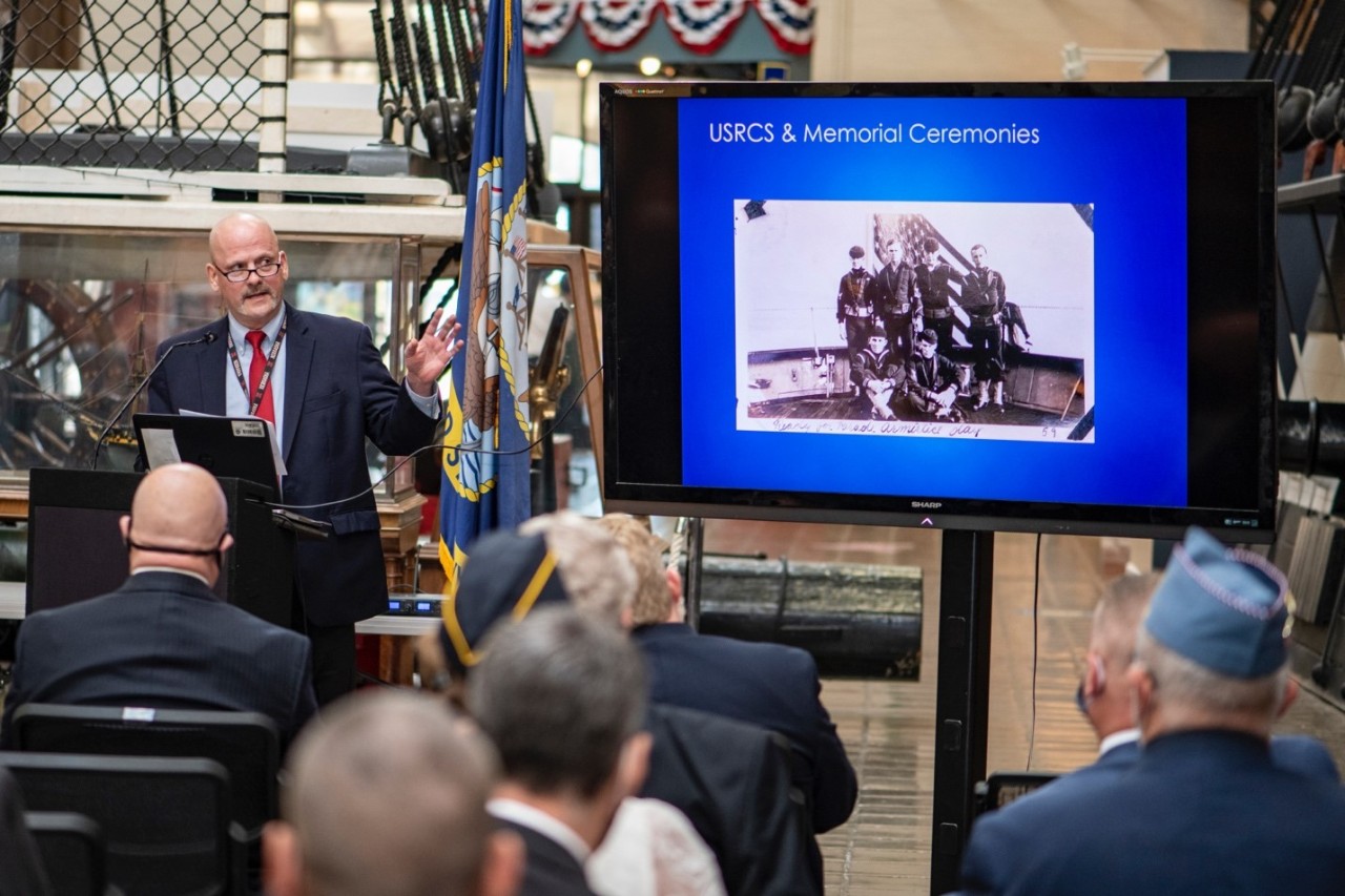 Scott Price, Chief Historian, Historian’s Office, U.S. Coast Guard Headquarters, speaks to guests during a symposium and commemoration for the 100th anniversary of the arrival of the Unknown Soldier