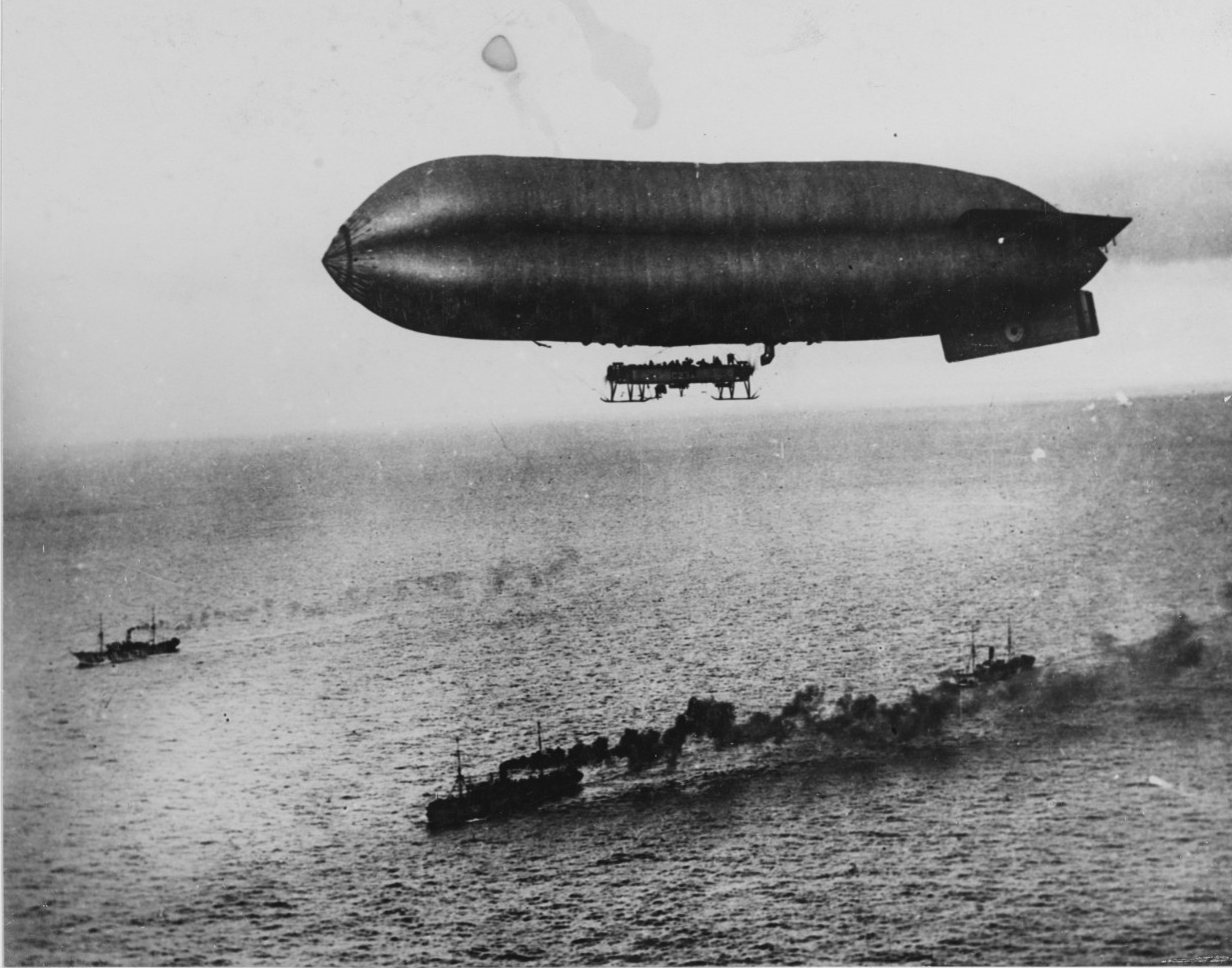 An airship escorts a convoy into Brest Harbor, France, 1918.