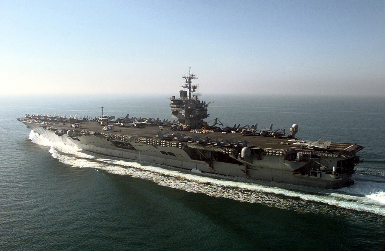 981217-N-8492C-015: USS Enterprise (CVN-65), 1998. The aircraft carrier USS Enterprise (CVN-65) makes its way to the southern end of its operating area the morning after the first wave of air strikes against Iraq during Operation Desert Fox. Offi...