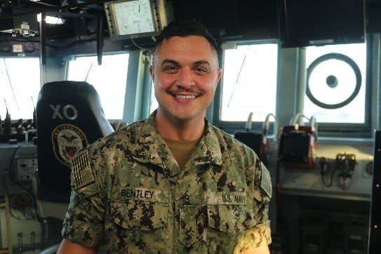 man in uniform standing smiling