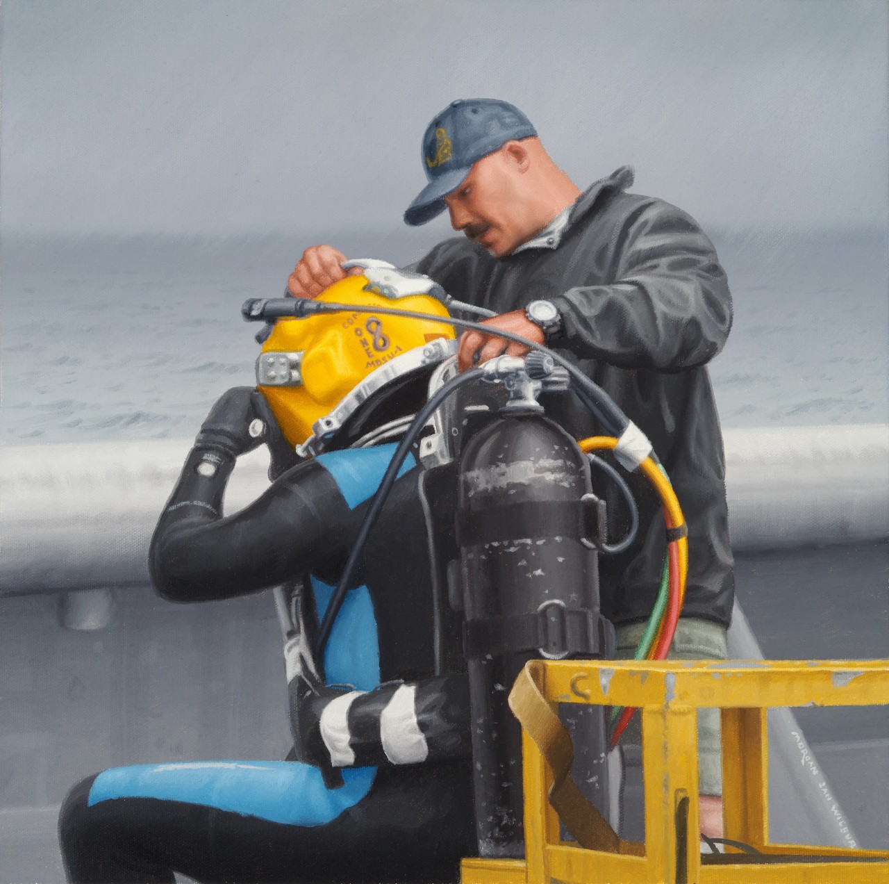 A man in a ball cap and a jacket is helping a diver with his gear