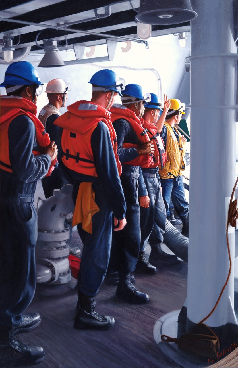 A group of sailors wearing life jackets and helmets wait at a hatch for the signal to go on deck