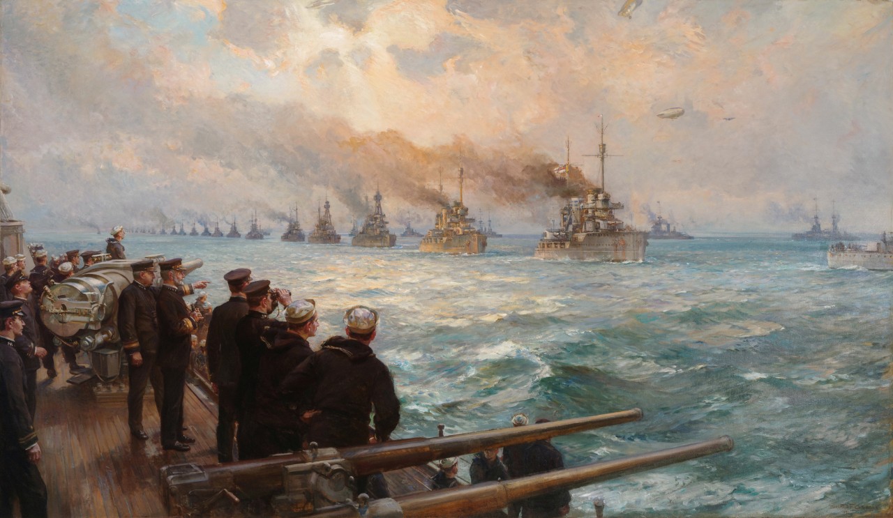 A fleet of ships approach in a line. On the left side of the picture the crew of a ship watches the fleet