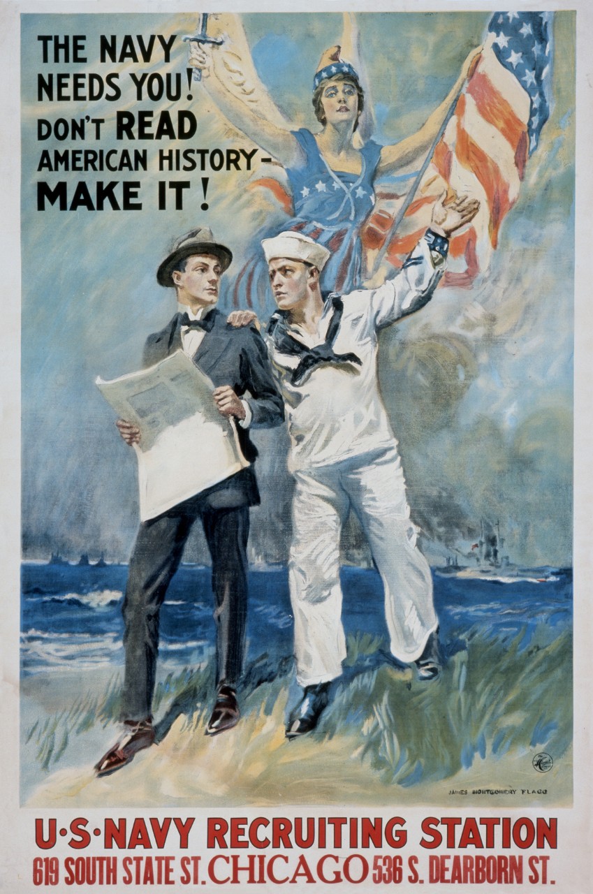 A sailor with his hand on a men’s shoulder behind them a women wrapped in the American flag