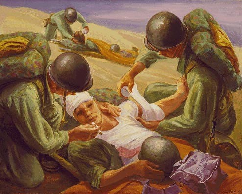 Two corpsmen helping the injured on the beach