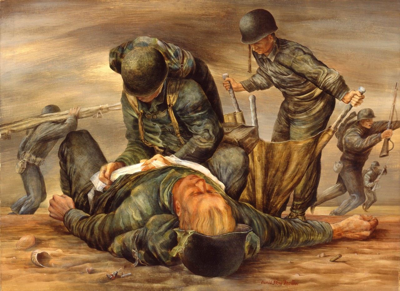 Two navy corpsmen treat causality on the beach