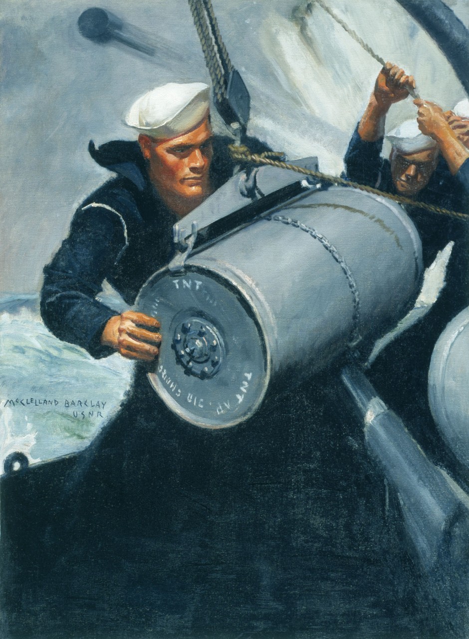 Sailor loading a depth charge