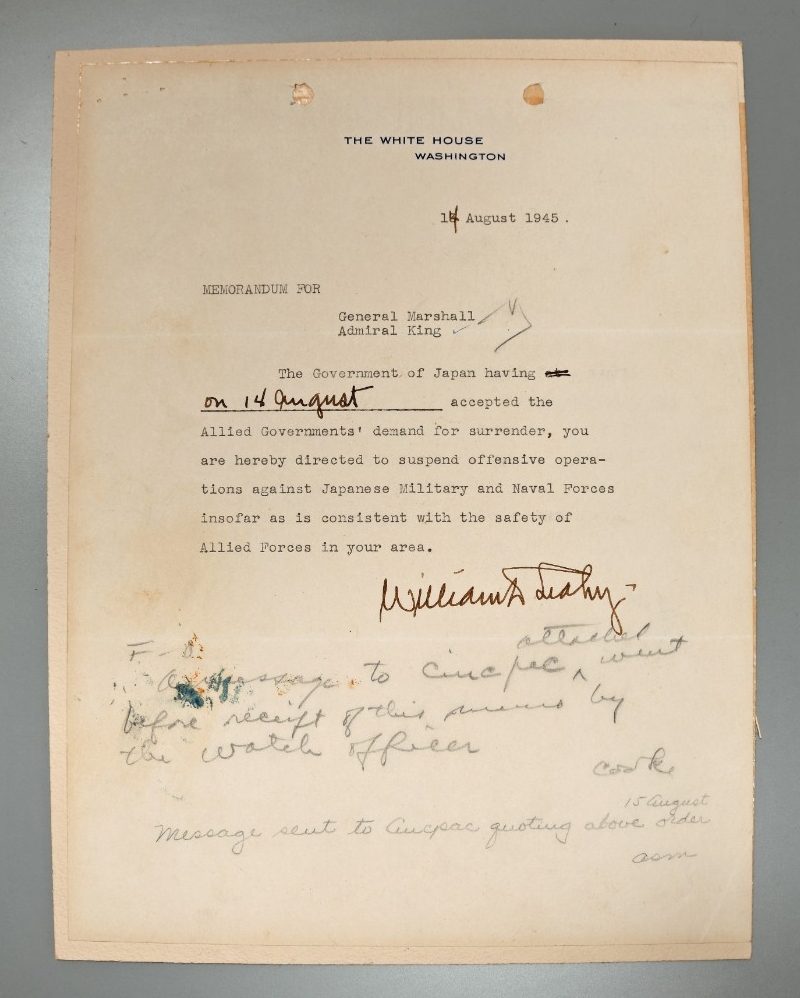 Typed memorandum with handwritten notes concerning the suspension of offensive operations against Japan, signed by Fleet Admiral William Leahy.