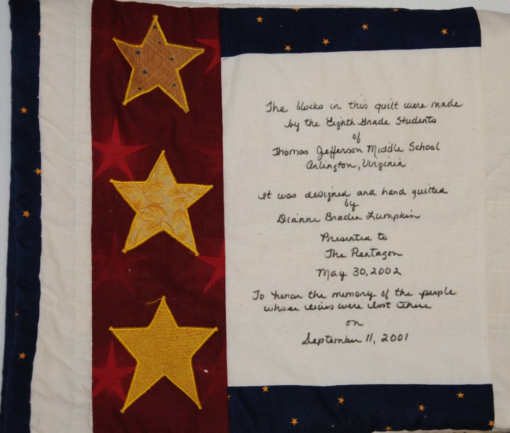 Handwritten label in black ink on reverse of quilt, "The blocks in this quilt were made bu the Eighth Grade Students of Thomas Jefferson Middle School Arlingotn, Virginia. It was designed and hand quilted by Dianne Braden Lumpkin. Presented to Th...