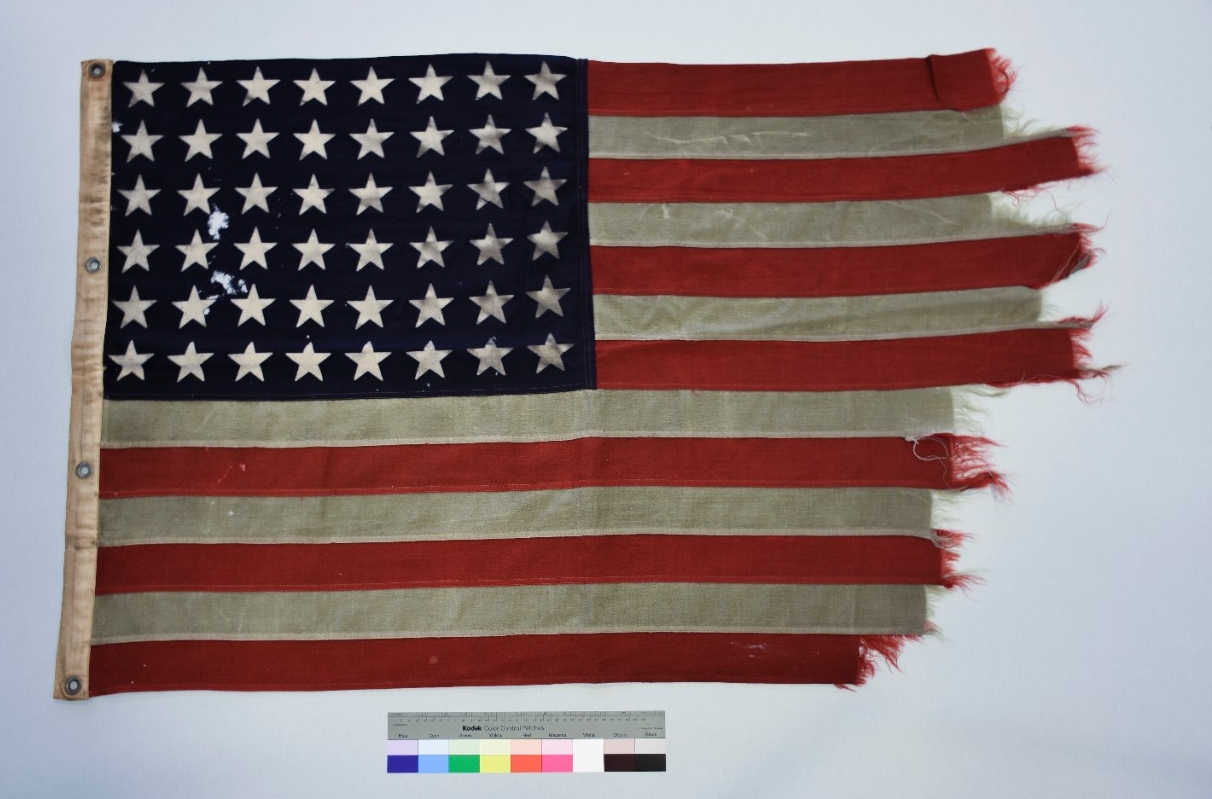 Cotton flag canvas hoist heavy fraying and loss at fly. 48 stars on blue field at canton. 4 metal grommets