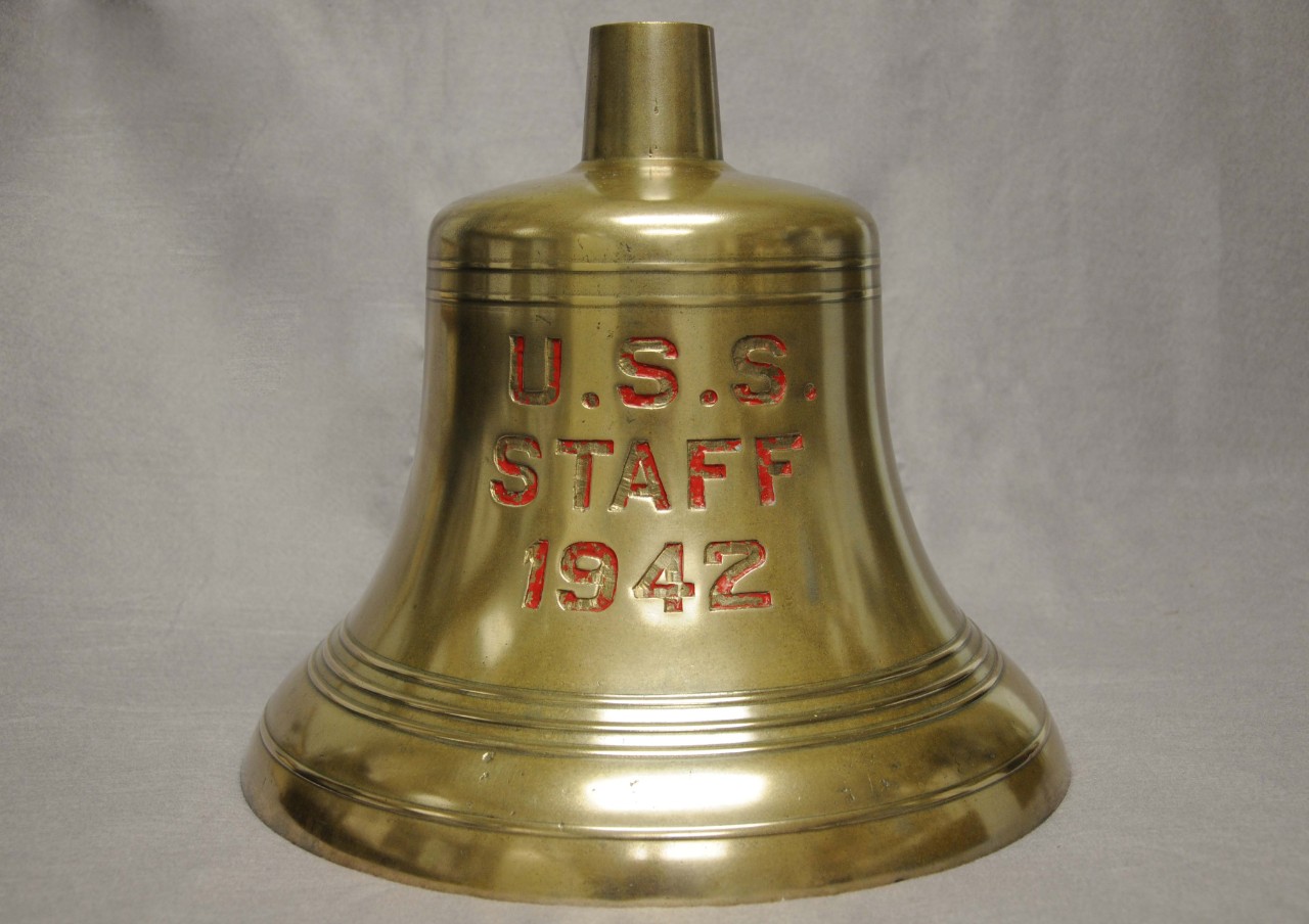 Bell has concentric circles and is stamped U.S.S. Staff 1942