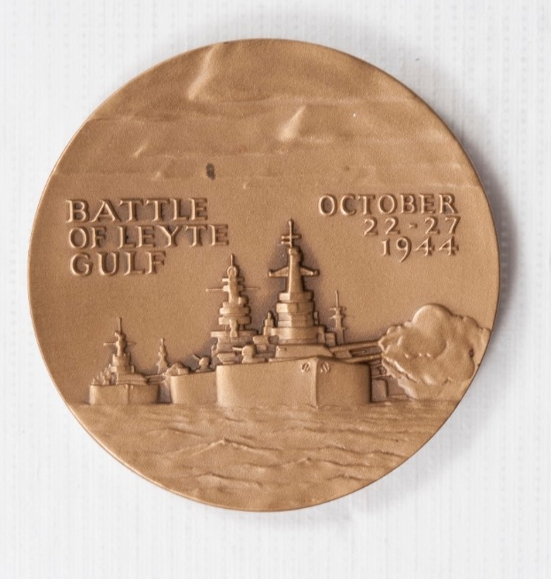 Round Bronze with raised image of ships with Battle of Leyte Gulf October 22-27 1944 in raised letters