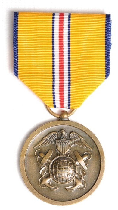 Round bronze planchet with insignia of US Coast and Geodetic Survey attached to ribbon of yellow with thin blue white and red pinstripes in center.
