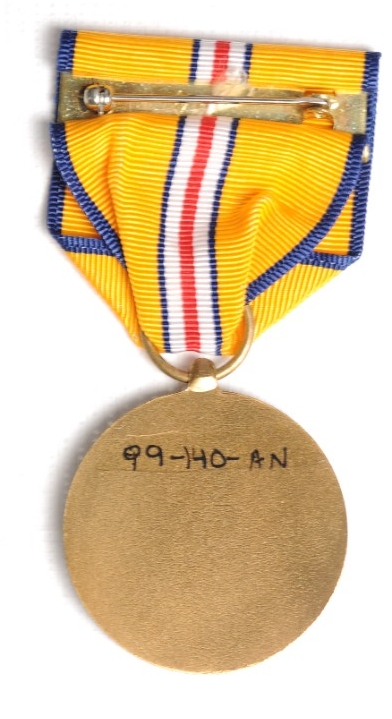 Reverse image of US Coast and Geodetic Survey Pacific Warzone Medal with pin and clasp visible