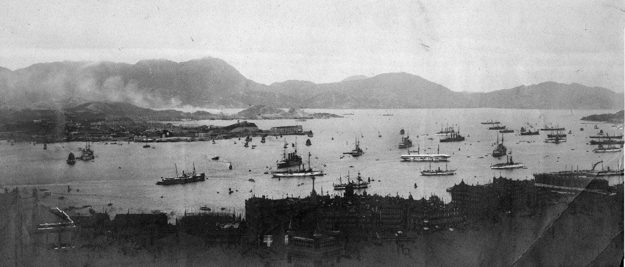 5 black and white photographs donated by Captain Joseph F. Evans, USN (Ret). Views of Punta Arenas, Chile and Guam in 1908. View of Hong Kong harbor circa 1910, with many ships present: USS Cleveland (C-19), USS North Carolina (CA-12), USS Chattanooga (C-16), USS Denver (C-14), USS Helena (PG-9), HMS Hawke, HMS Merlin, HMS Monmouth, HMS King Alfred, HMS Kent, HMS Bedford, HMS Tamar, French protected cruiser D'Entrecasteaux. Some images have been assigned NH numbers.